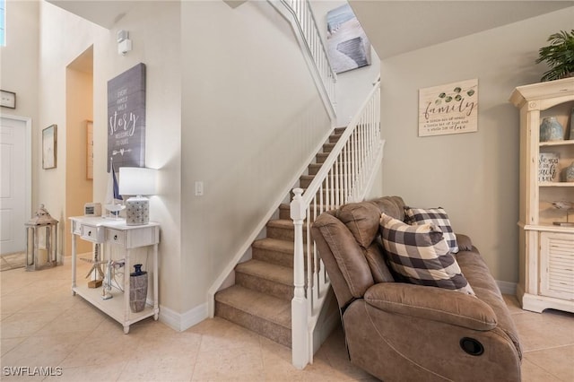 stairway featuring tile patterned flooring