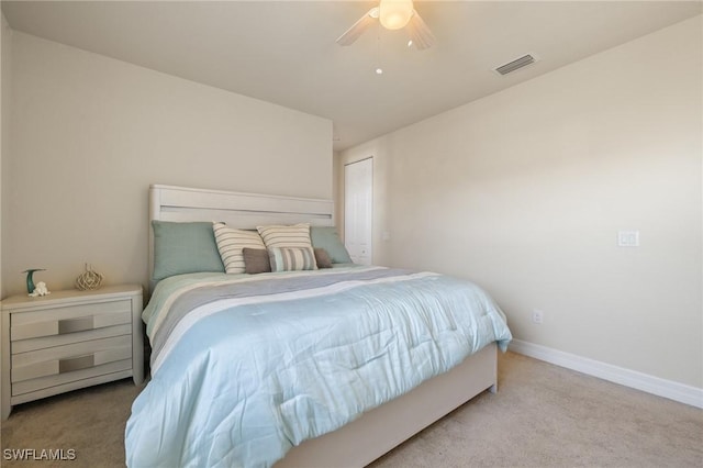 bedroom featuring light colored carpet and ceiling fan