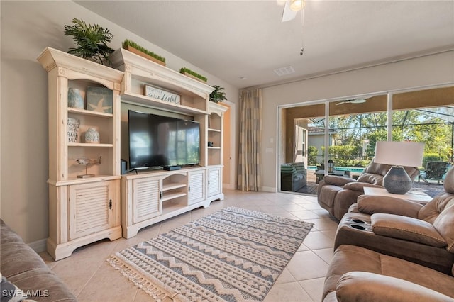 tiled living room with ceiling fan