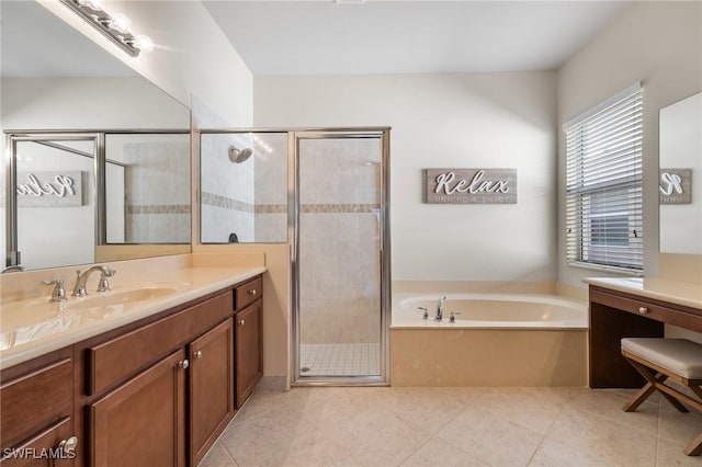 bathroom featuring independent shower and bath, vanity, and tile patterned flooring