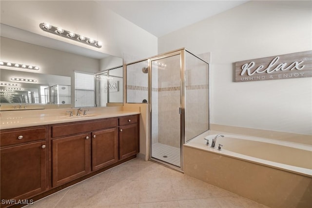 bathroom featuring vanity, tile patterned floors, and shower with separate bathtub