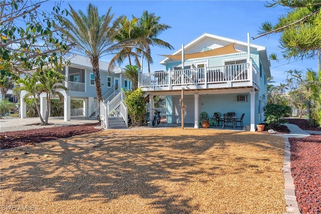 view of front facade with a deck and stairway