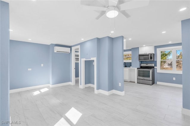 unfurnished living room with a wall mounted AC and ceiling fan