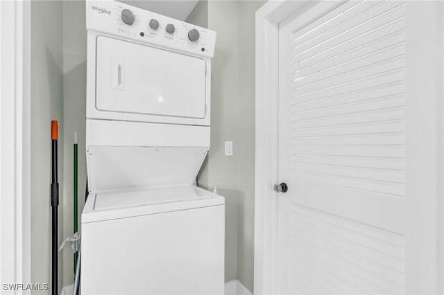 laundry room with stacked washer and dryer