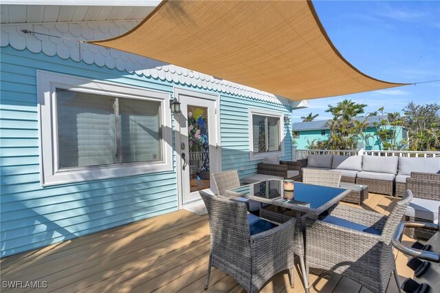 wooden deck featuring an outdoor hangout area