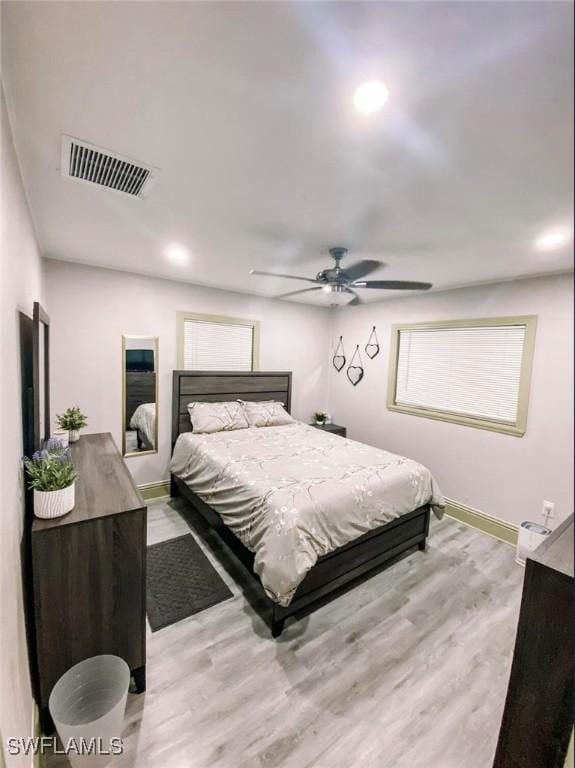 bedroom featuring hardwood / wood-style flooring and ceiling fan