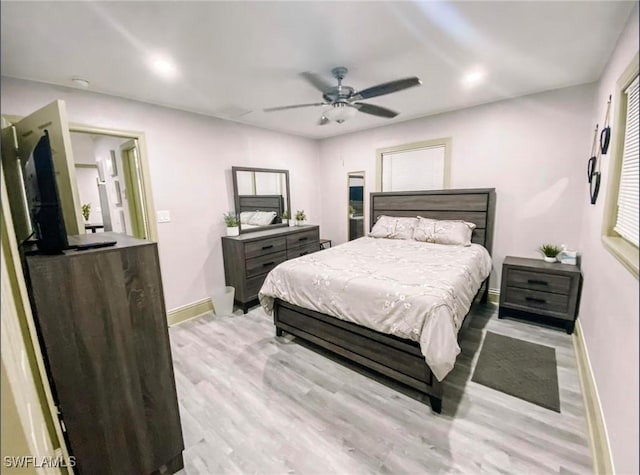 bedroom featuring ceiling fan and light hardwood / wood-style floors