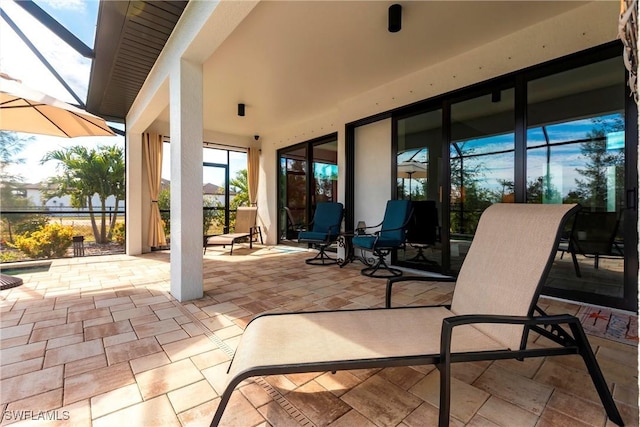 view of patio with a lanai