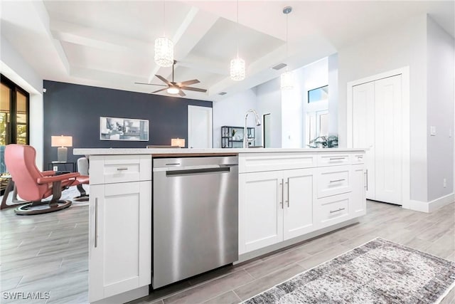 kitchen with white cabinetry, dishwasher, an island with sink, hanging light fixtures, and ceiling fan