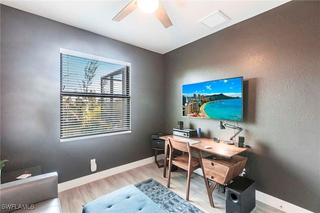 office with ceiling fan and light wood-type flooring