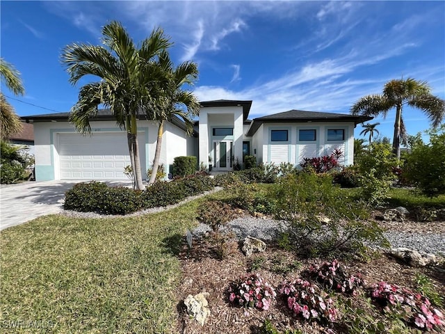 view of front facade featuring a garage and a front yard