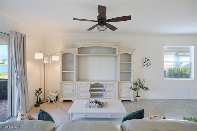 living room with light tile patterned flooring, ceiling fan, and ornamental molding