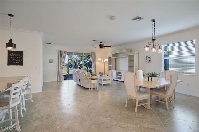 dining area with light tile patterned floors, ornamental molding, and ceiling fan