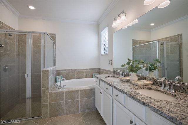 bathroom featuring tile patterned flooring, crown molding, shower with separate bathtub, and vanity