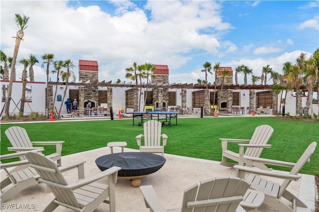 view of patio featuring an outdoor stone fireplace