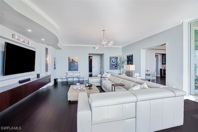 living room featuring ornamental molding, a notable chandelier, and dark hardwood / wood-style flooring