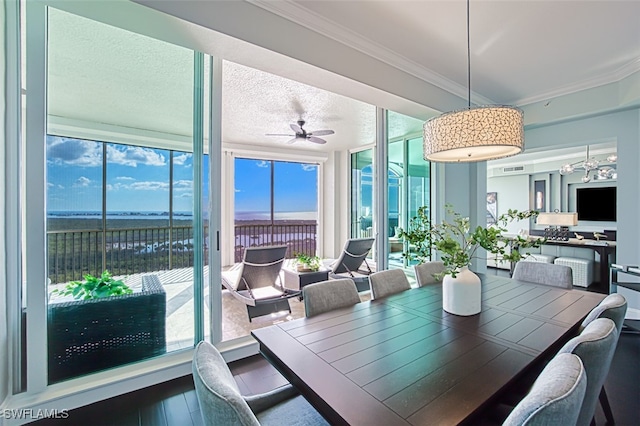 sunroom / solarium featuring ceiling fan