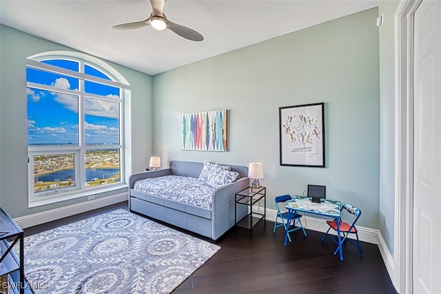 bedroom with dark wood-type flooring and ceiling fan