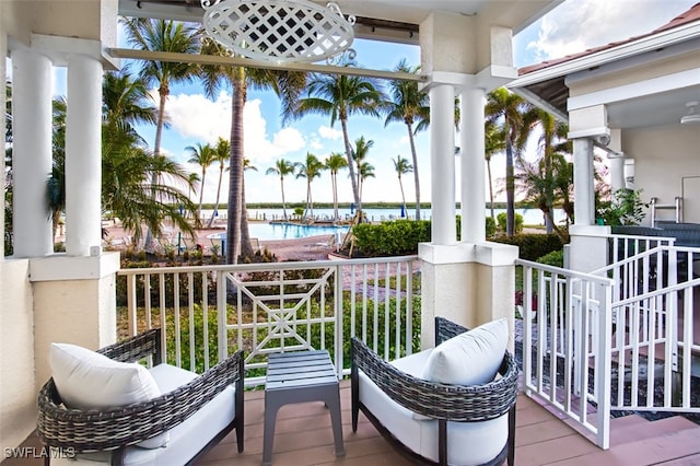 balcony featuring a water view