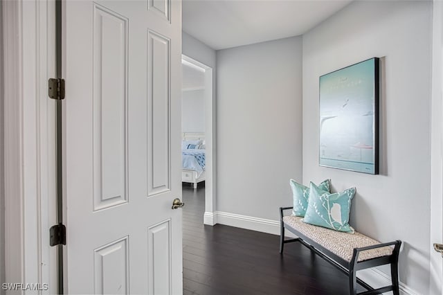 corridor featuring dark hardwood / wood-style flooring