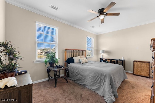 carpeted bedroom with multiple windows, crown molding, and ceiling fan