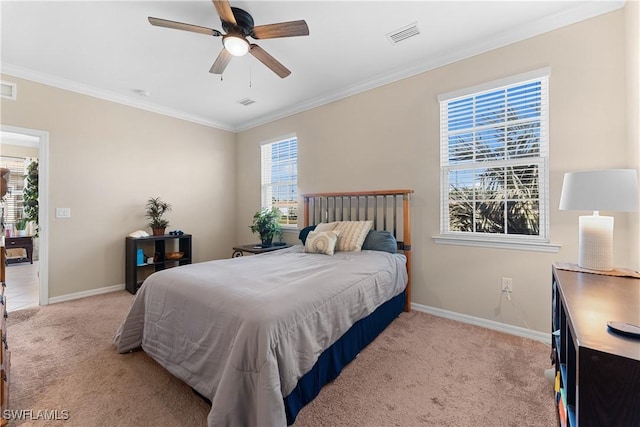 carpeted bedroom featuring ceiling fan and ornamental molding