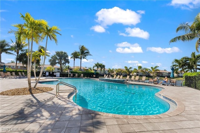 view of swimming pool featuring a patio area