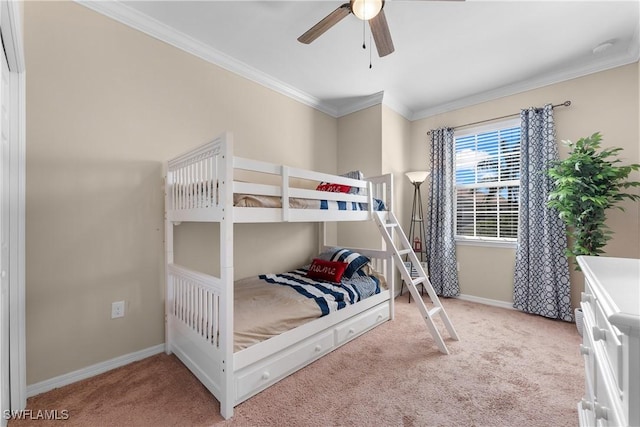 carpeted bedroom featuring crown molding and ceiling fan