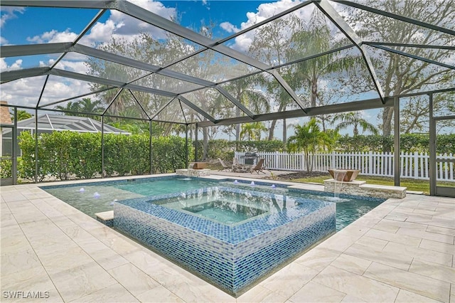 view of swimming pool with an in ground hot tub, pool water feature, a patio area, and glass enclosure