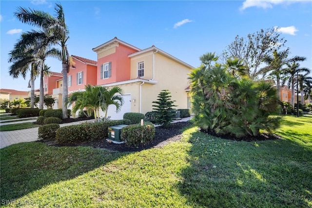 view of property exterior with a lawn