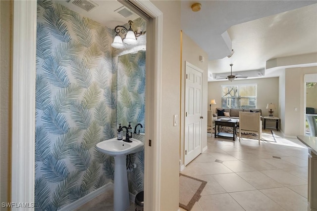 bathroom with ceiling fan, tile patterned floors, and sink