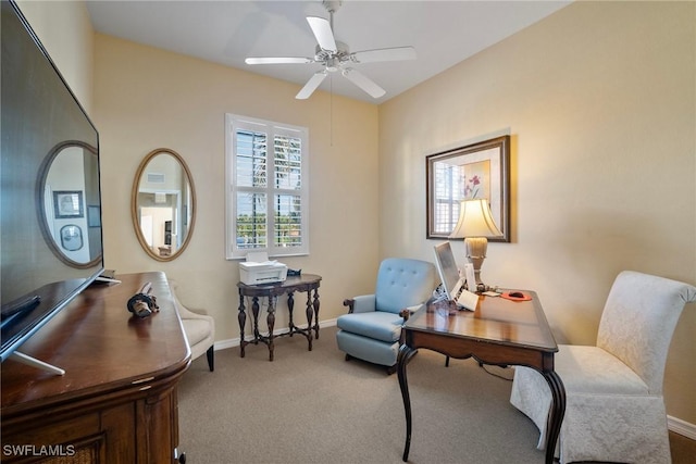 home office with ceiling fan and carpet flooring