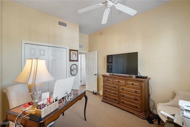 office space featuring light colored carpet and ceiling fan