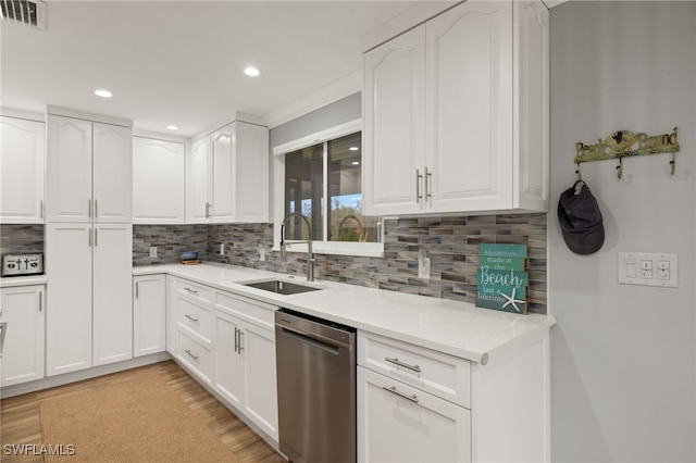 kitchen with sink, stainless steel dishwasher, and white cabinets