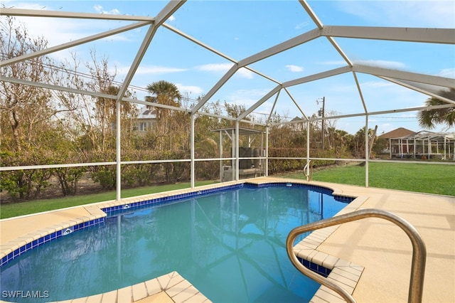 view of swimming pool featuring a yard, a lanai, and a patio