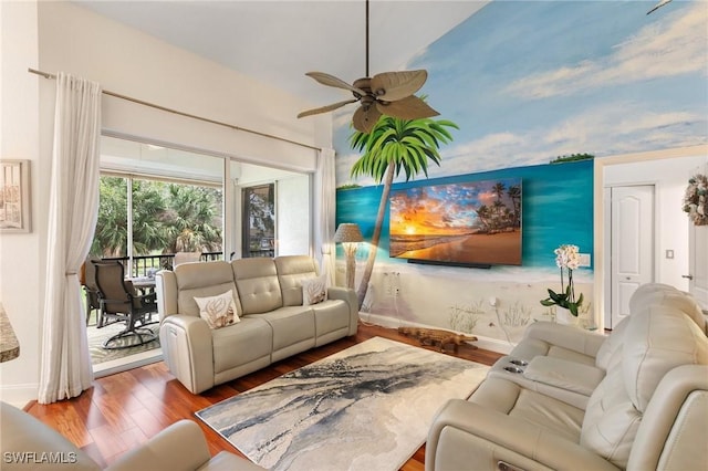 living room featuring wood-type flooring and ceiling fan