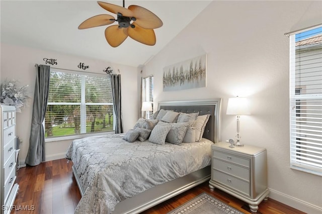 bedroom with lofted ceiling, dark hardwood / wood-style floors, and ceiling fan