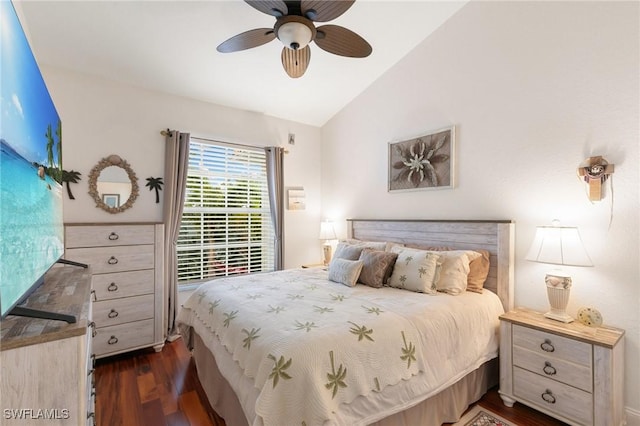 bedroom with ceiling fan, lofted ceiling, and dark hardwood / wood-style flooring