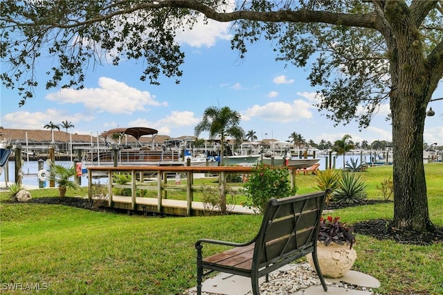 exterior space featuring a lawn and a water view