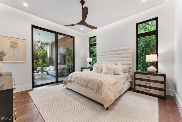 bedroom with dark hardwood / wood-style flooring, access to outside, and ceiling fan