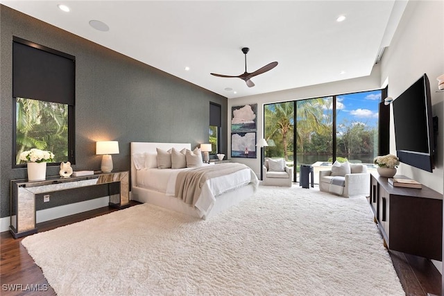 bedroom featuring dark hardwood / wood-style flooring and ceiling fan