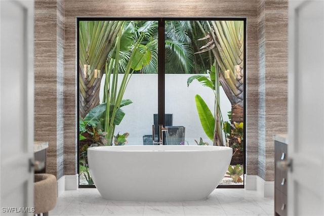 bathroom with a bathing tub and a wealth of natural light