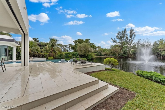 view of patio featuring a water view