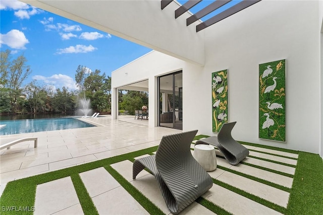 view of swimming pool with a patio area