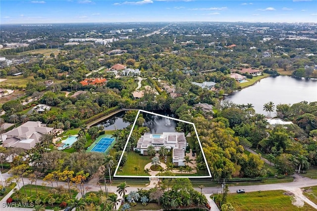 birds eye view of property with a water view