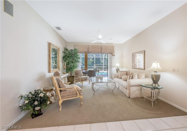 carpeted living room with ceiling fan