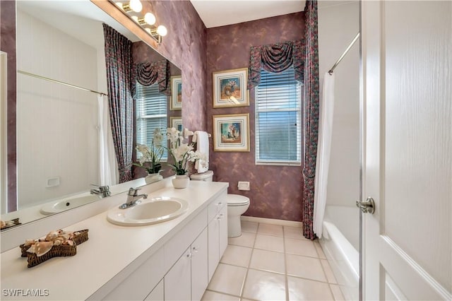 full bathroom with shower / tub combo, vanity, a healthy amount of sunlight, tile patterned floors, and toilet