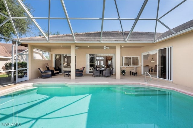 view of pool with a lanai, outdoor lounge area, a patio, and ceiling fan