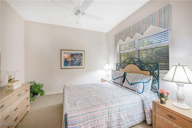 bedroom with light carpet and ceiling fan