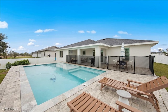 view of swimming pool with a patio